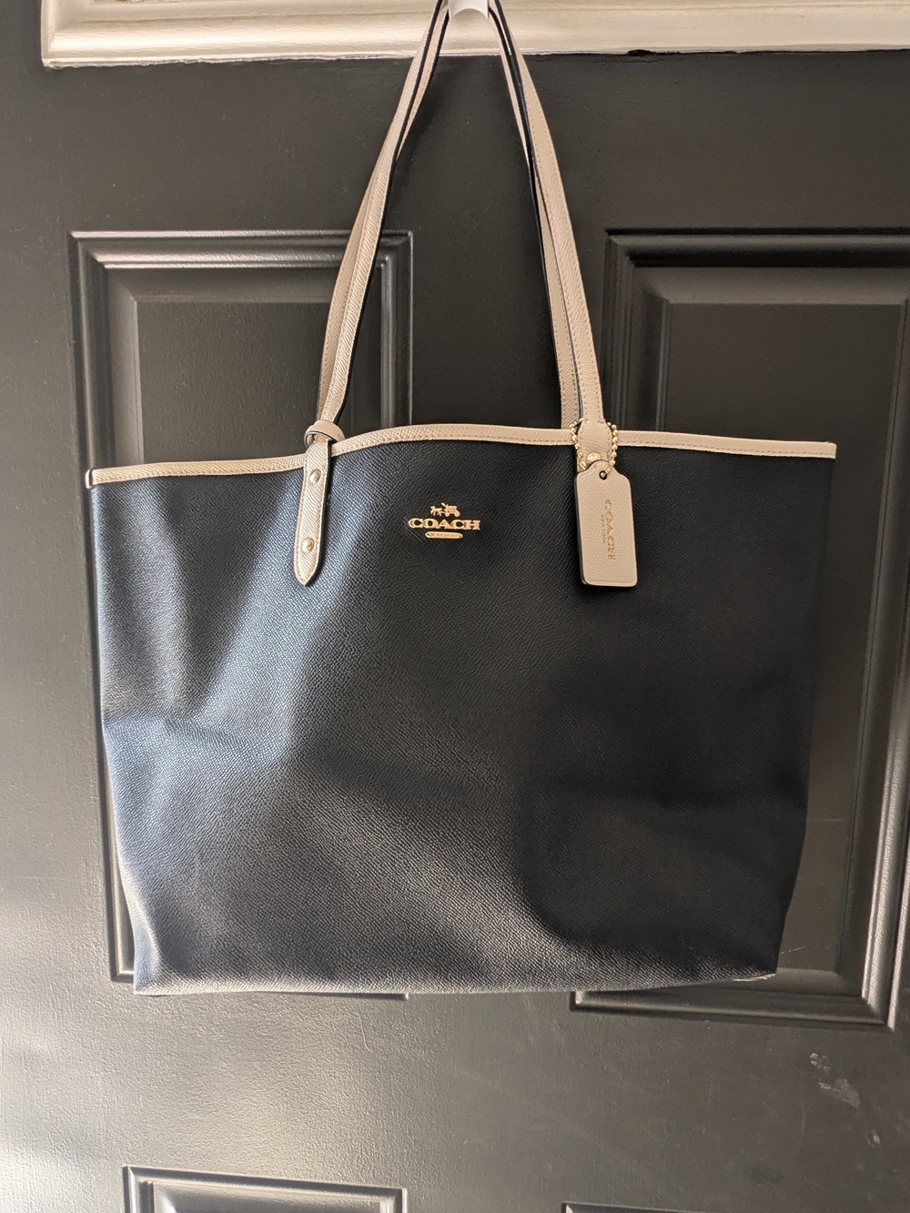 black and chalk-white Coach Reversible City Tote